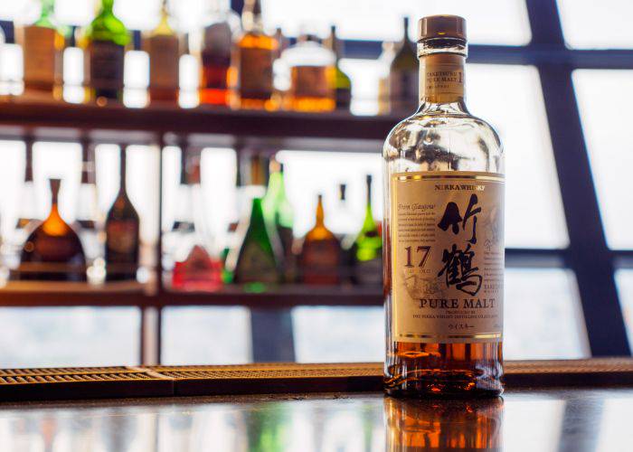 A bottle of Nikka Whisky on a bar in Japan.